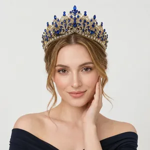 Vintage gold alloy crown with blue rhinestones worn by a model for party photoshoot