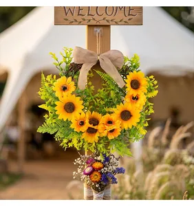 Detailed view of a vibrant sunflower wreath with a burlap bow on a wooden post