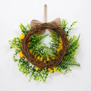 Back view of sunflower wreath with natural grapevine base and rustic jute bow