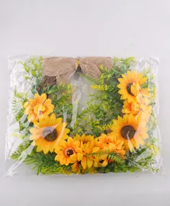 Detailed close-up showing the sunflower wreath inside its clear plastic packaging bag