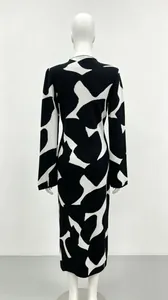Back view of slim fit knit dress with black and white abstract pattern