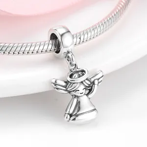 Close-up detail of S925 sterling silver angel charm pendant on snake chain bracelet.