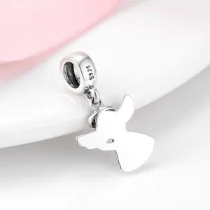 Macro view of a S925 sterling silver angel wing charm pendant showing hallmark details