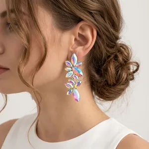 Stunning iridescent marquise crystal floral leaf earrings worn by a model for elegant events