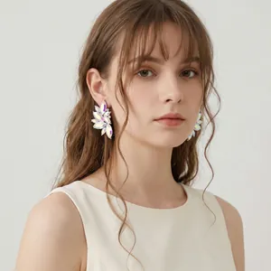 Iridescent marquise stone leaf flower stud earrings on model for elegant party wear.