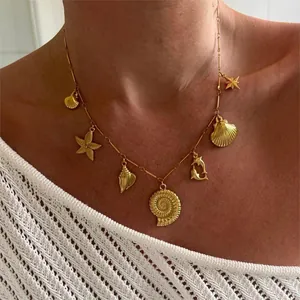 Elegant nautical gold charm necklace with starfish and sea shell pendants for women