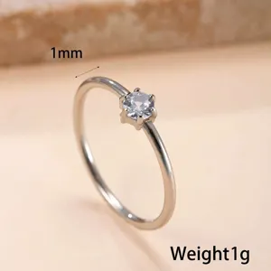 Detailed view of a 1mm stainless steel ring with a shiny six-prong solitaire zircon