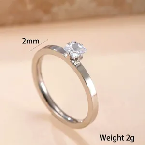 Macro detail view of a 2mm stainless steel ring featuring a square-cut clear zircon stone