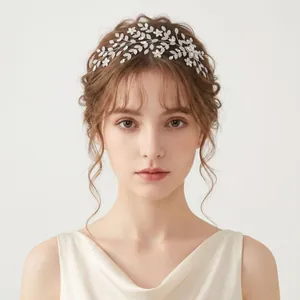 Close-up detail of a silver vine bridal headpiece with shimmering zircon leaves