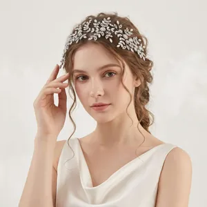Elegant vine leaf bridal headband with sparkling zircons for wedding hair styling.