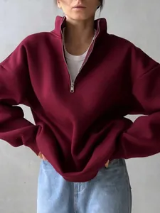 Stylish oversized burgundy half-zip sweatshirt with warm fleece lining for women
