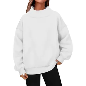 Detail view of a white mock neck oversized sweatshirt with soft fleece texture