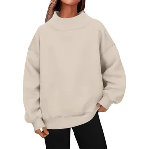Close-up detail of a beige oversized high neck sweatshirt with soft fleece lining