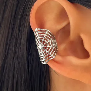 Detailed close-up view of a silver spider web ear cuff for Halloween punk festive style