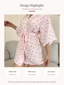 Detailed view of pink floral seersucker robe featuring wide sleeves and self-tie belt.