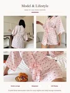 Detail view of a pink floral seersucker robe shown in various cozy lifestyle home settings
