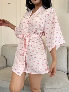 Detailed view of women's pink floral cotton kimono sleepwear robe with waist tie