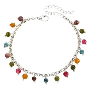 Detail view of a silver-tone chain bracelet featuring vibrant multi-colored stone beads.
