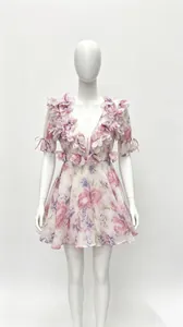 Detailed view of a sweet French floral dress with 3D flower appliqués and V-neckline