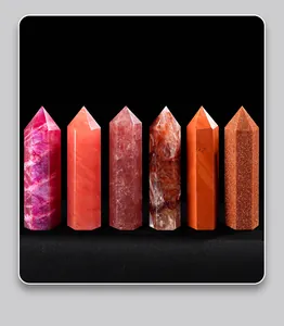 Detailed view of six natural hexagonal crystal pillars in various red and orange tones