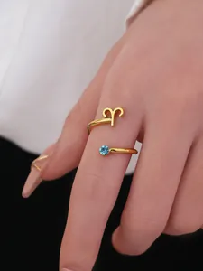 Close-up of Aries zodiac open ring with light blue gemstone detail