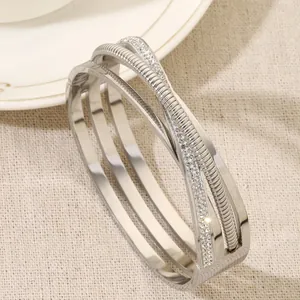 Elegant multi-layer crisscross silver titanium steel bangle with sparkling crystal pave detail