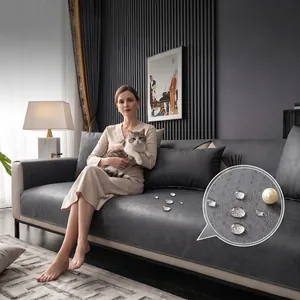 Close-up detail of waterproof tech fabric sofa cover protector with water droplets