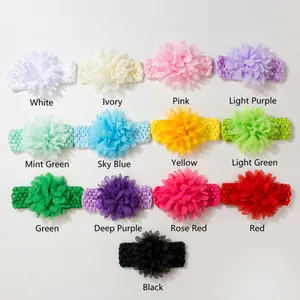 Multiple colors of chiffon flower headbands for baby girls in a neat grid display.