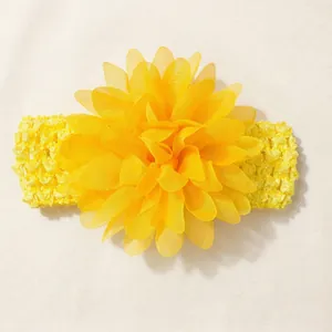 Macro detail view of yellow chiffon flower baby headband with elastic crochet band