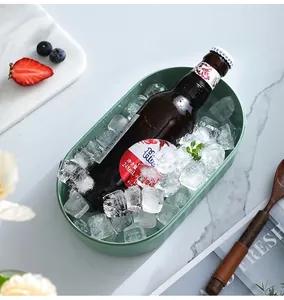 Green silicone ice cube mold box used for chilling bottled drinks with fresh ice