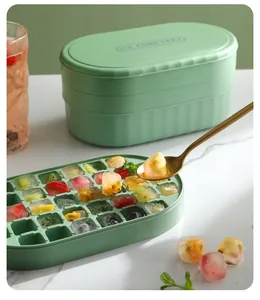 Green silicone ice cube tray set with storage box and colorful fruit-filled ice cubes