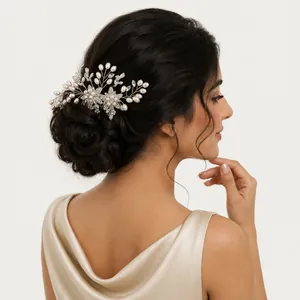Detailed view of the pearl and crystal flower hair comb styled in an elegant bridal updo