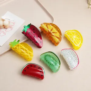 Assorted vibrant fruit-shaped acrylic hair claw clips featuring lemon and strawberry