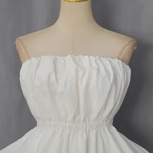 Close-up of white ruffled tube top showing pleated fabric texture and elastic waist