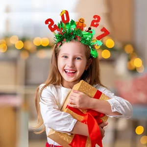 Detailed view of child wearing Christmas 2021 headband with gingerbread man decoration