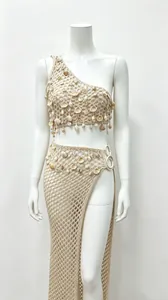 Detail of handmade crochet beach set featuring natural shell embellishments and split.