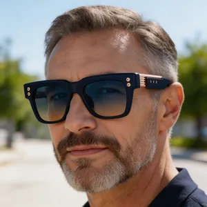Close-up of men's vintage square sunglasses with blue gradient lenses and gold accents