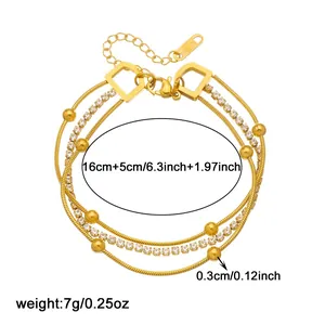 Detailed view of triple-layer gold-plated bracelet with beads and rhinestones, 16+5cm length