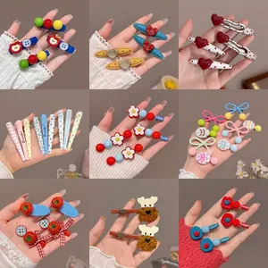 Macro view of assorted colorful Korean style hair clips with various cute patterns.
