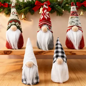 Set of 5 festive Christmas gnomes with knitted hats and white beards on wooden shelf.