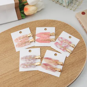 Sakura pink non-marking hair clips set with marbled patterns on white display cards