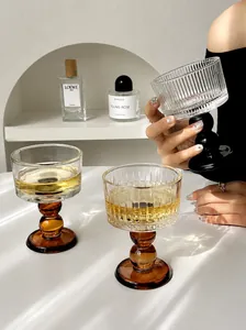 Elegant vintage ribbed glass goblet with a stylish amber bulbous stem.