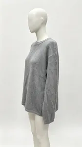Side view showing the relaxed fit of a cozy gray oversized knitted pullover sweater for women