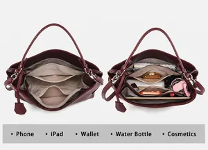 Detailed interior view of a large capacity burgundy handbag showing daily storage space