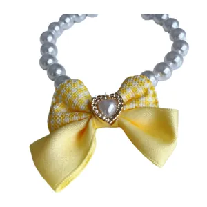 Elegant white pearl pet collar with a cute yellow gingham bow for small dogs and cats