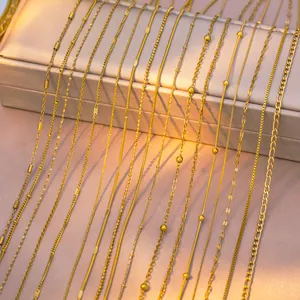Close-up detail of various gold titanium steel necklace chain styles and links.