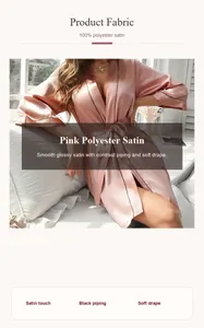 Gros plan du peignoir en satin rose avec liseré noir contrasté et drapé fluide.