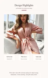 Détails d'un peignoir en satin rose avec passepoil contrasté et ceinture à nouer.