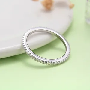 Close-up detail of a delicate S925 silver eternity ring with sparkling cubic zirconia