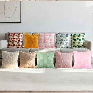 Collection of plush embroidered throw pillow covers with floral and textured patterns